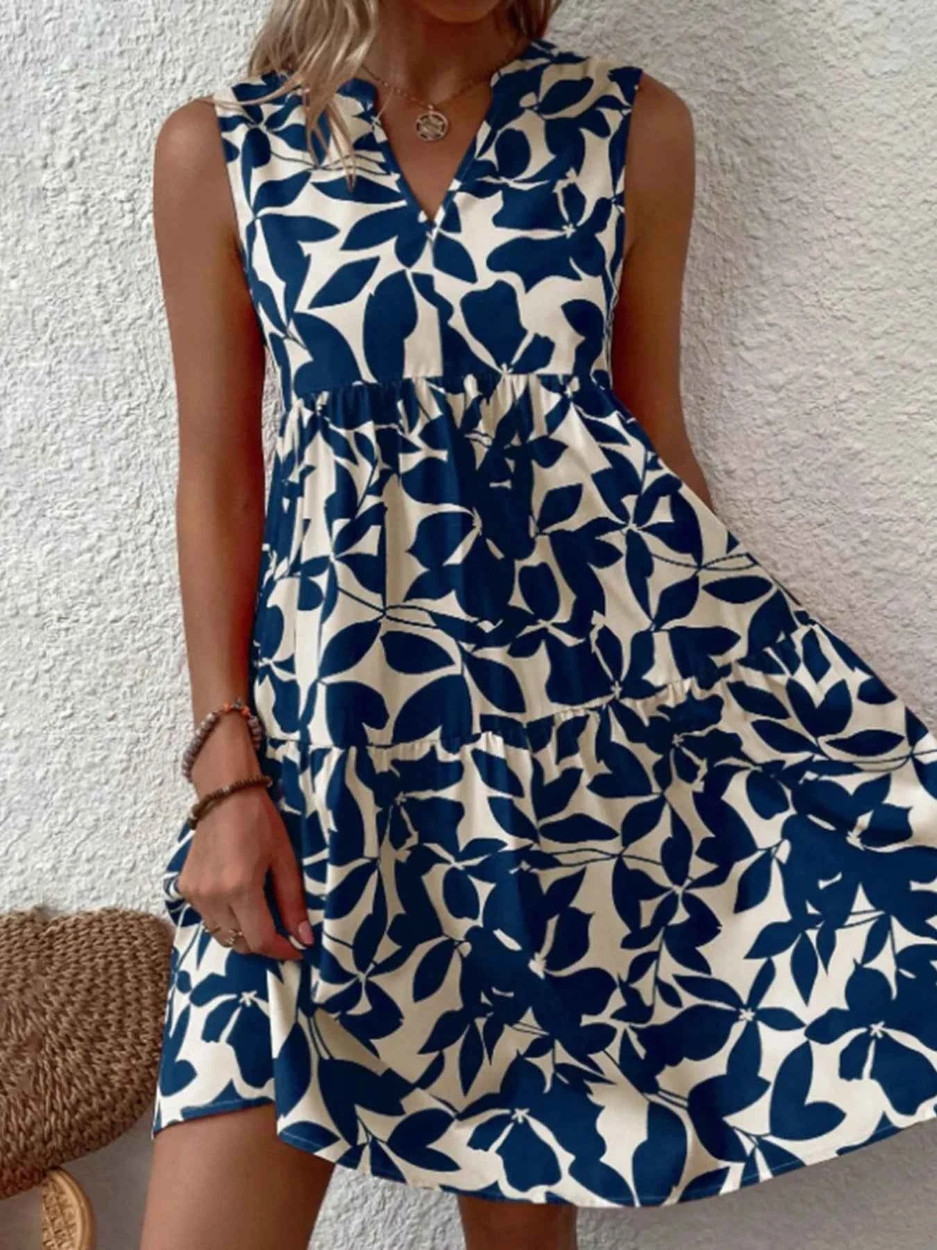 Printed V-Neck Sleeveless Mini Dress ef43daf42f894ed59553f30bf84c278c-Max-Origin