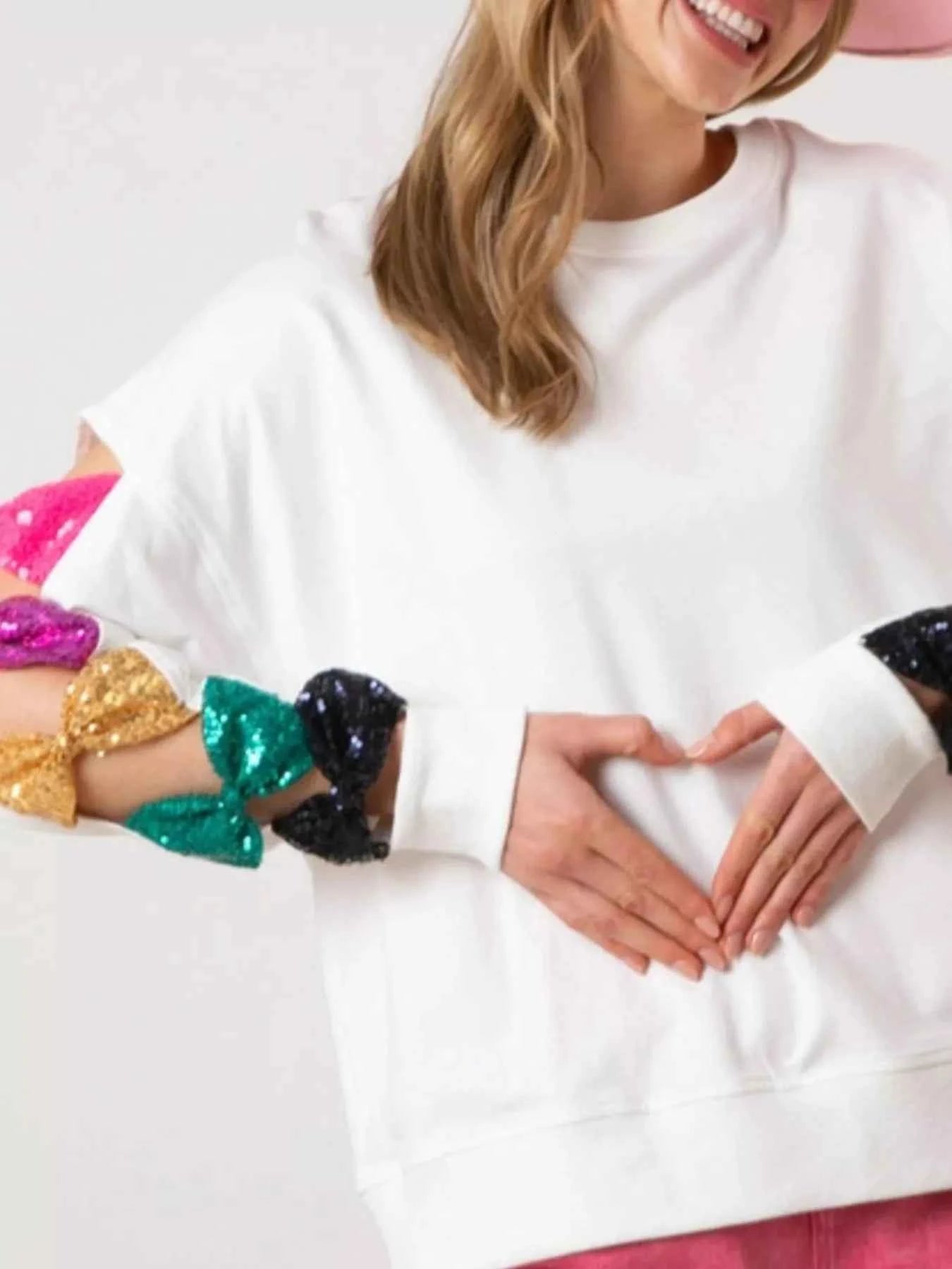 Sequin Bow Cutout Round Neck Sweatshirt White 0647e3a1-69ca-44c3-b378-0a74bcc21179-Max-Origin