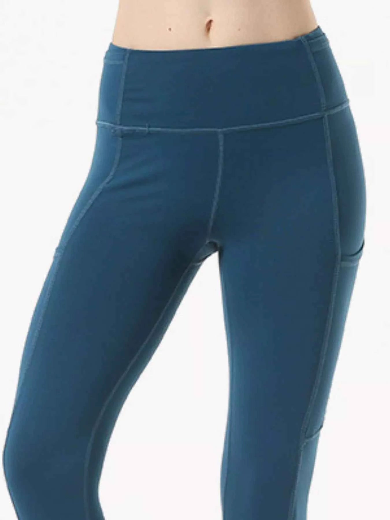 Full Size High-Waisted Active Leggings with Pockets Plus Size Peacock Blue 14225c39-c170-4d4e-992b-04c253d8136d-Max-Origin