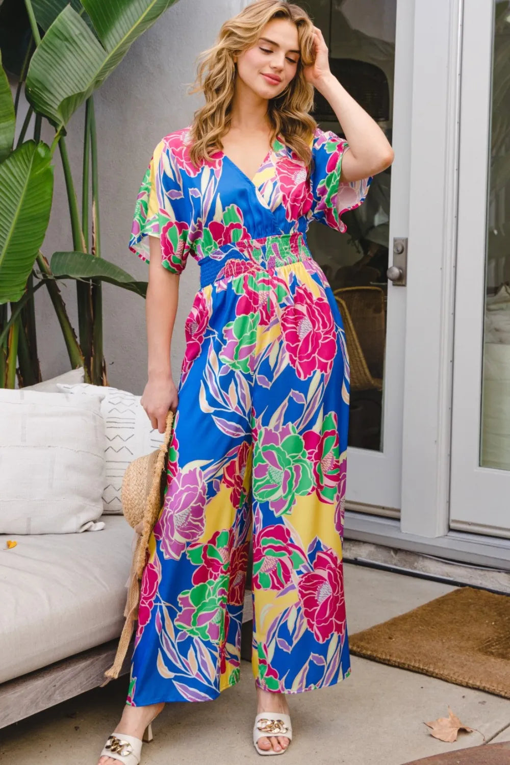 ODDI Full Size Floral Smocked Tied Back Jumpsuit 59bc1662-10ef-49f7-98fb-983b953fd149-Max