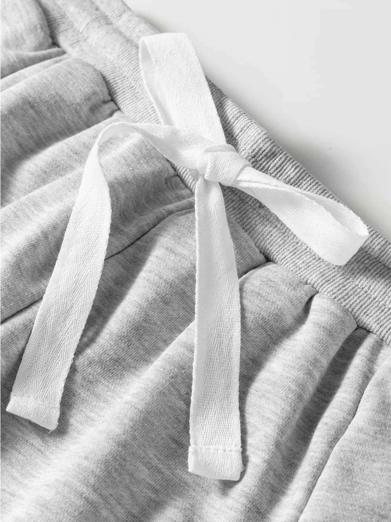 Lace Patchwork Drop Shoulder Top and Drawstring Skort 2pcs Outfit 64c2e8e7c9ba4573914e5ce5320b300d-Max-Origin