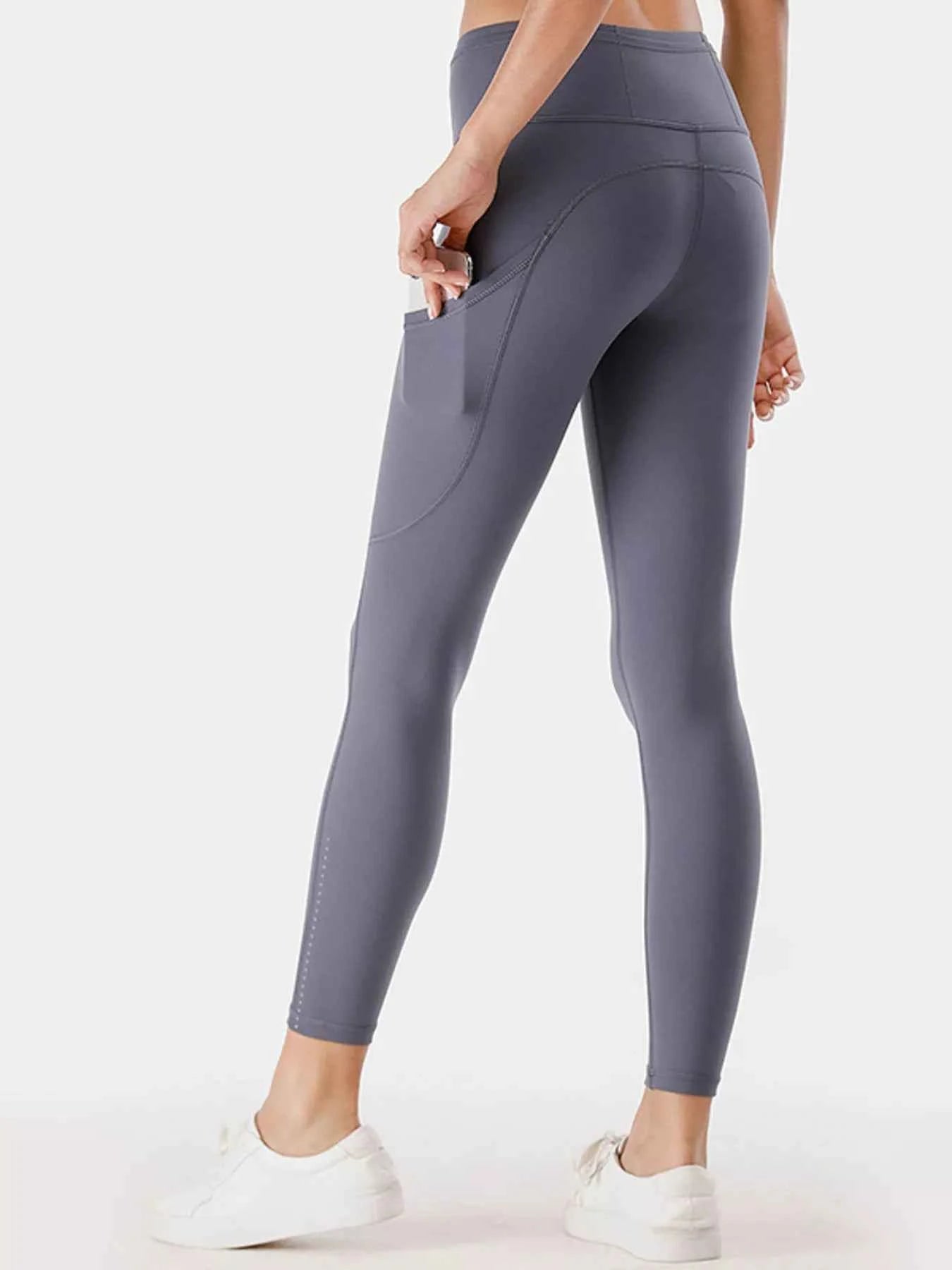 Full Size High-Waisted Active Leggings with Pockets Plus Size 69ab8195e6f5472b8872b47081845b3d-Max-Origin