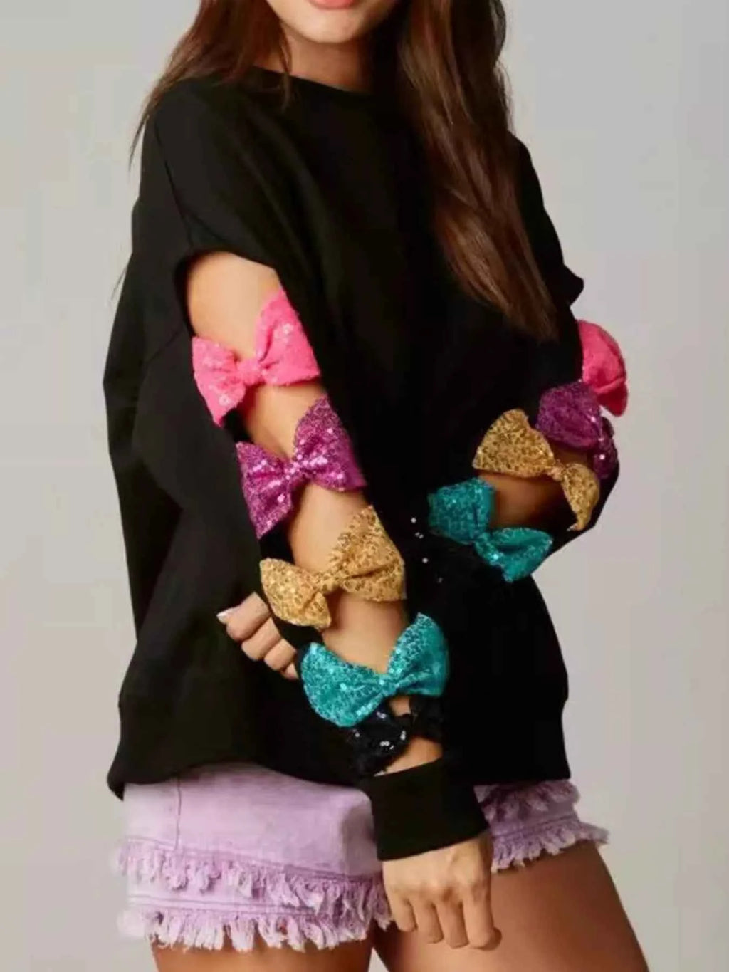 Sequin Bow Cutout Round Neck Sweatshirt Black 886b6cf3-779c-41f2-a7f3-d95891c87f12-Max-Origin