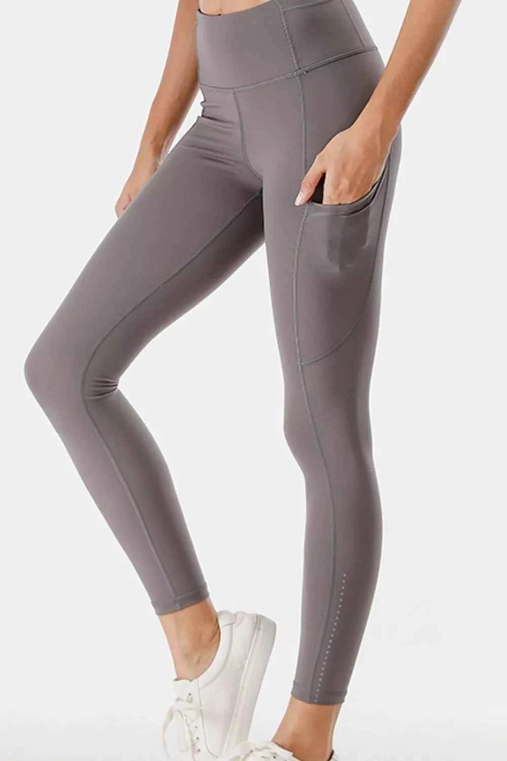 Full Size High-Waisted Active Leggings with Pockets Plus Size Gray 9896c52a-204b-4535-a705-c759017b3211-Max-Origin