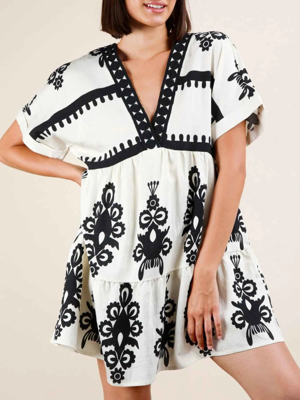 Printed V-Neck Short Sleeve Mini Dress a1a601e9-8680-4477-a6f4-313fd01d5fcc-Max-Origin
