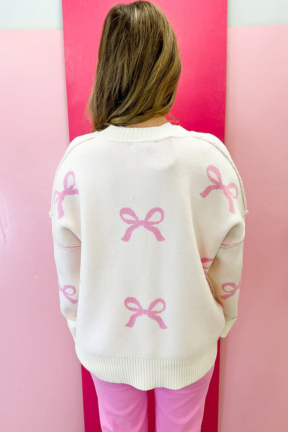 Pink Bow Print Exposed Seam Drop Sleeve Sweater b72572c7f7f842a3