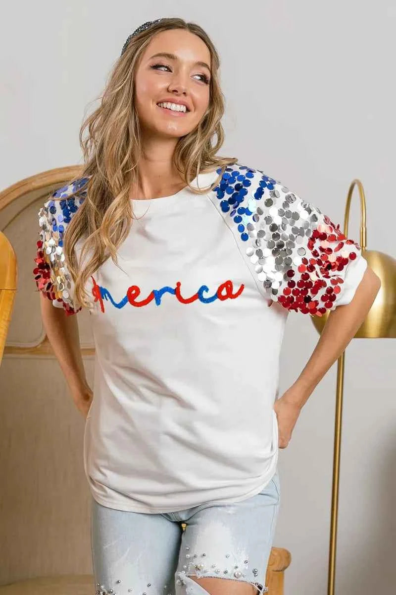 BiBi America Letter Applique Spangle Puff Sleeves Top cd5239083a8c47ab9f895ea3340bb1e0-Max-Origin